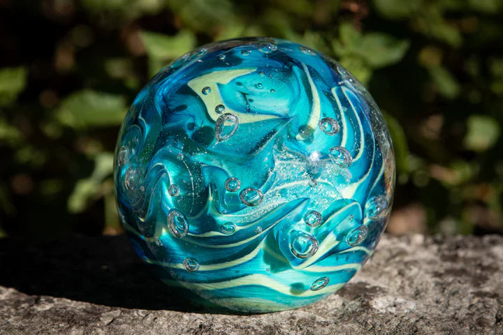Glass orbs with cremation ash