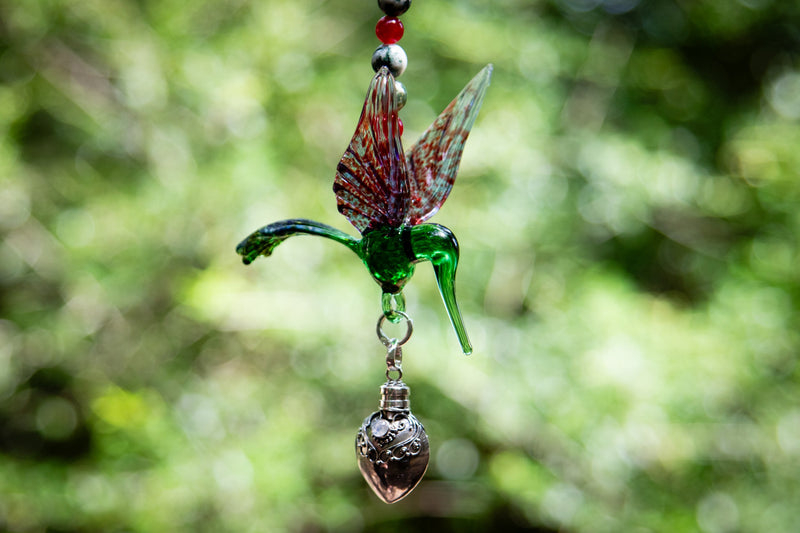 hummingbird with silver keepsake pendant