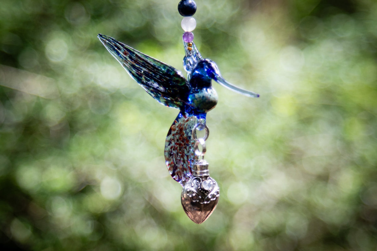 hummingbird with silver keepsake pendant